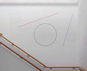 Black pencil, black crayon, yellow, red, blue crayon on wall