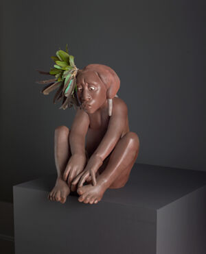 Clay, parrot feathers