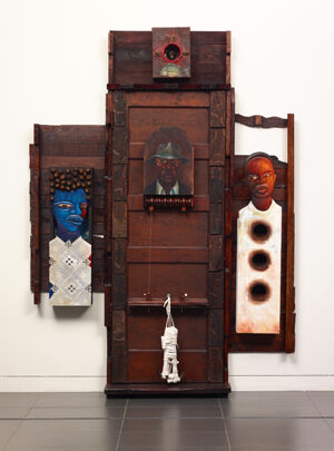 Wood, acrylic, oil, fabric, metal, wire, cowrie shells, walnuts, Brazil nuts, plaster, hemp, and canvas over cardboard